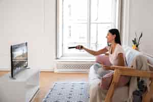 Free photo mom spending time in front of tv