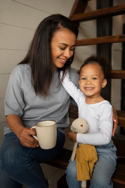 Free photo mom spending time with her black baby