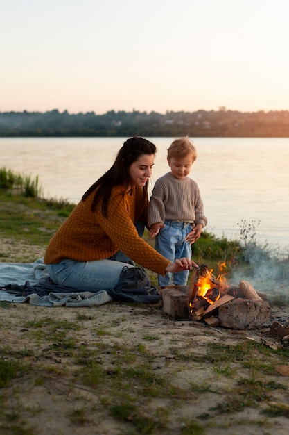 Mom spending time with kid at the beach