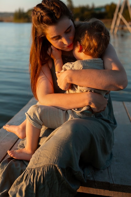 Mom spending time with kid at the beach