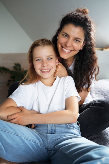 Mom taking care of  her daughter's hair