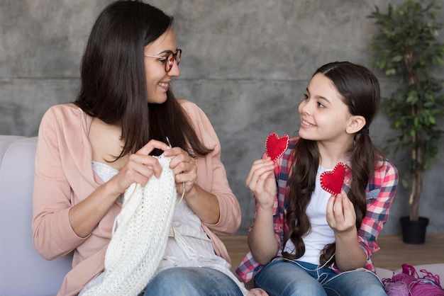 Free photo mom weaving to show girl