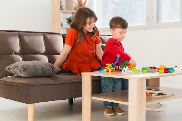 Mom with son at home playing