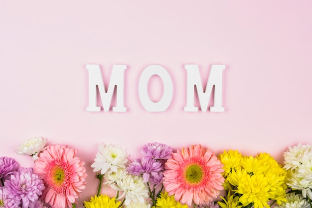 Mom word near bright fresh flowers