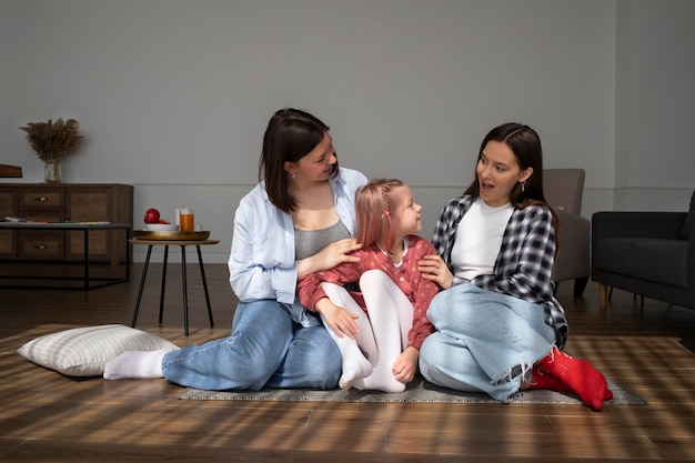 Free photo mommies spending time together with their daughter