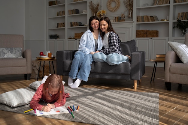 Free photo mommies spending time together with their daughter