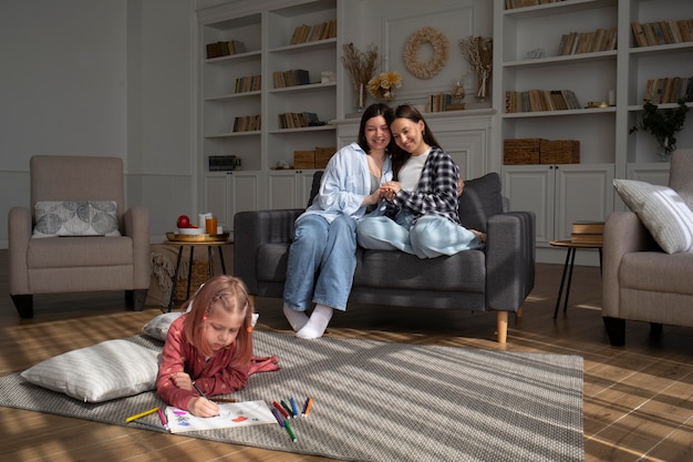 Free photo mommies spending time together with their daughter