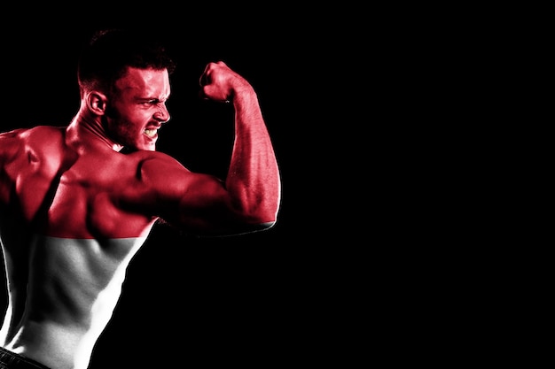 Monaco flag on handsome young muscular man black background