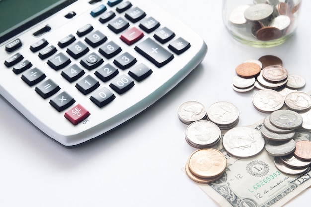 Free photo money coins with sunlight on white background, selective focus