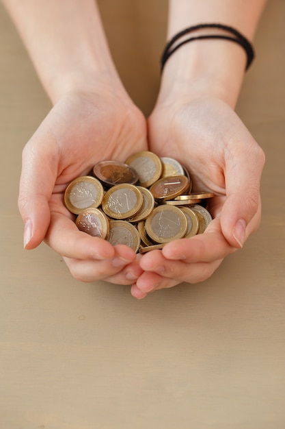 Free photo money, finance. woman with heap of coins