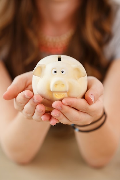 Free photo money, finance. woman with piggy