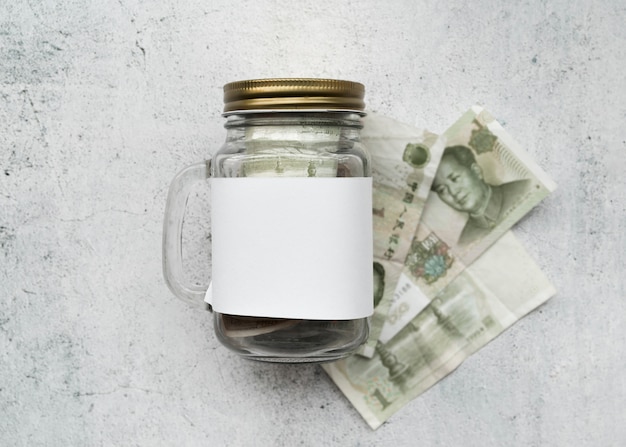 Money with glass jar