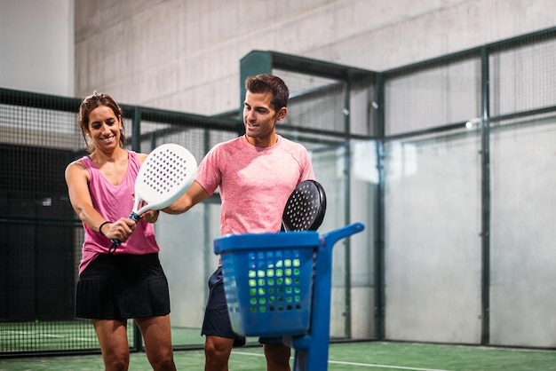 Monitor teaching padel class