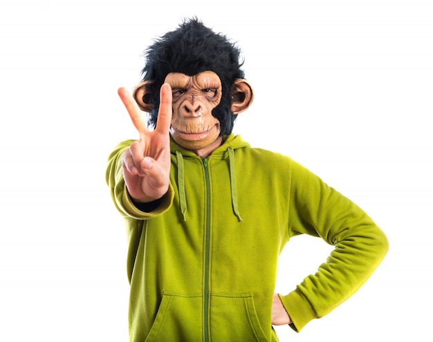 Free photo monkey man doing victory gesture