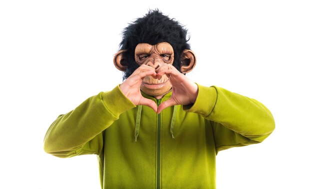 Monkey man making a heart with his hands