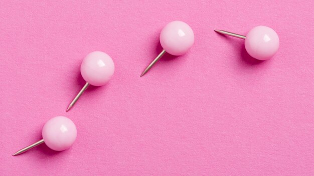 Monochromatic still life assortment with pink stationery objects