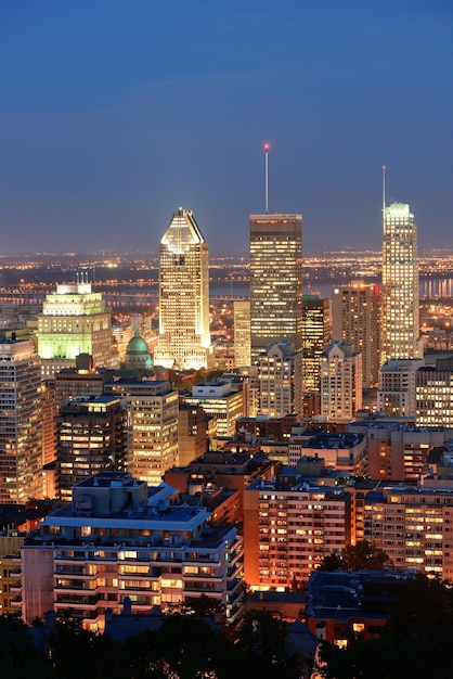 Montreal at dusk with urban skyscrapers viewed from Mont Royal