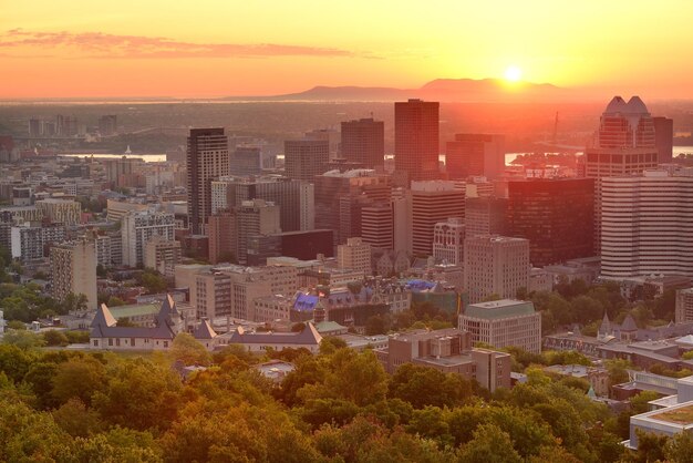Montreal sunrise silhouette viewed from Mont Royal with city skyline in the morning