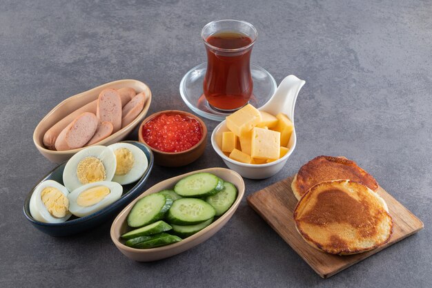 Morning breakfast placed on a marble surface. 