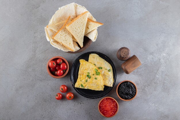 Morning breakfast placed on a marble surface. 