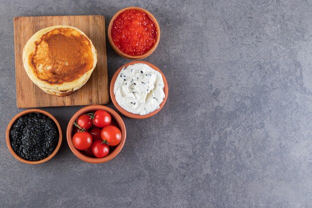 Morning breakfast placed on a marble surface. 