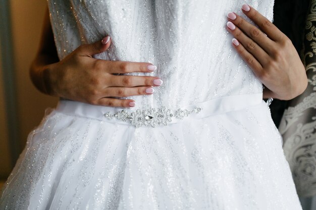 Morning of the bride when she wears a beautiful dress