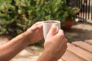 Free photo morning coffee cup on wooden board