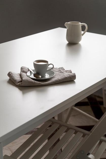 Morning cup of coffee on white table