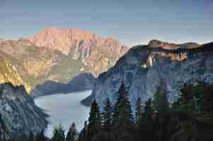 Free photo morning fog over lake koenigssee and obersee, mt. watzmann