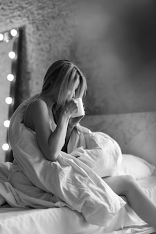 Morning girls the blonde with cup of tea coffee breakfast in bed i just woke up