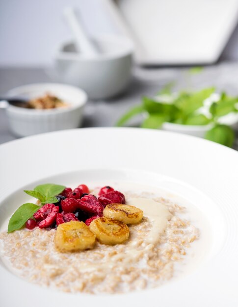 Morning meal with crushed cereals close-up