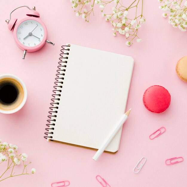 Morning office desk with coffee and stationery items