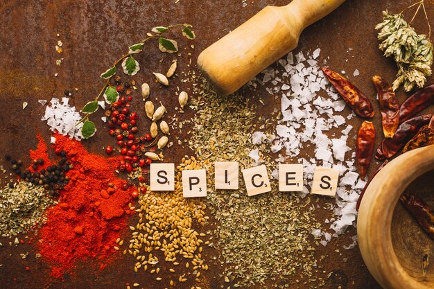 Mortar and pestle near spilled spices