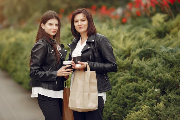 Mother and adult daughter with shopping bag