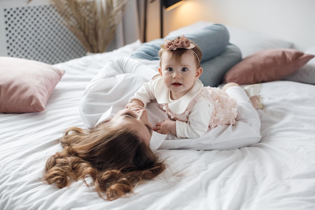 Free photo mother and baby at home