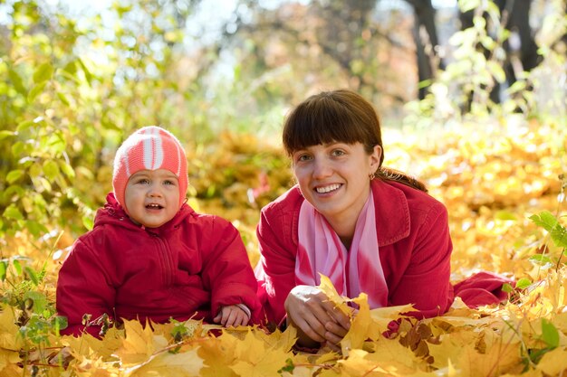 Mother and   baby laying on maple leaves