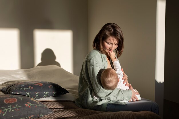 Mother breast feeding her baby