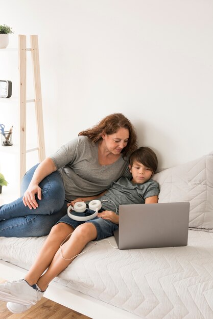 Mother and child looking on laptop