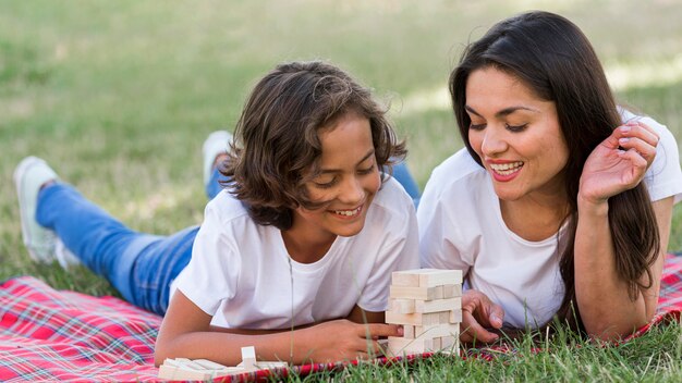 Mother and child playing together at the park