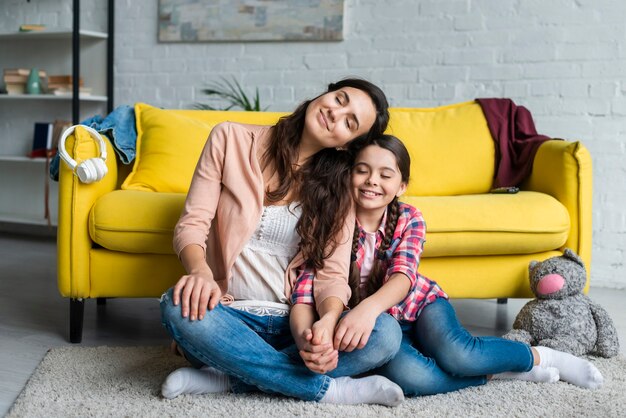 Mother and child sitting on the floor