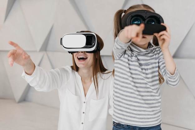 Mother and child using virtual reality headset together