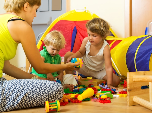 Mother and children playing 