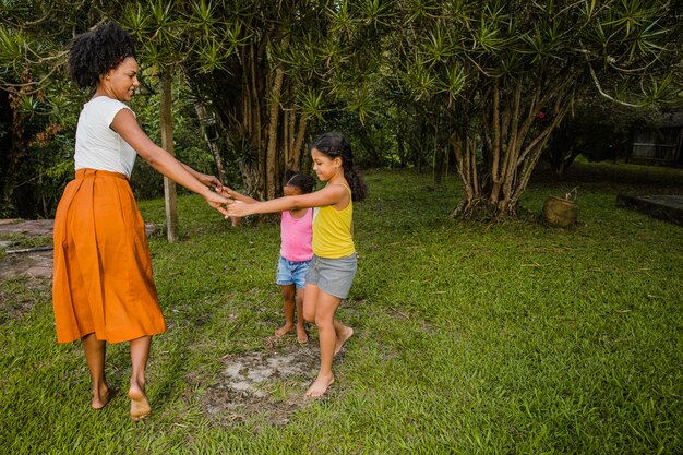 Mother dancing with daughters