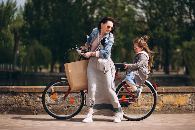 Mother and daughter bicycling