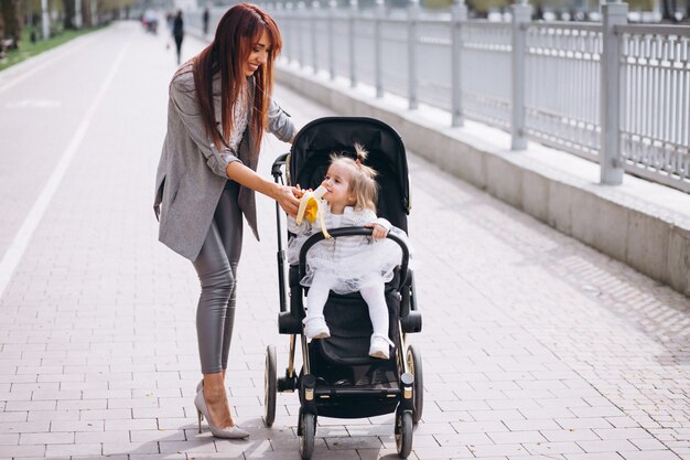 Mother and daughter by lake