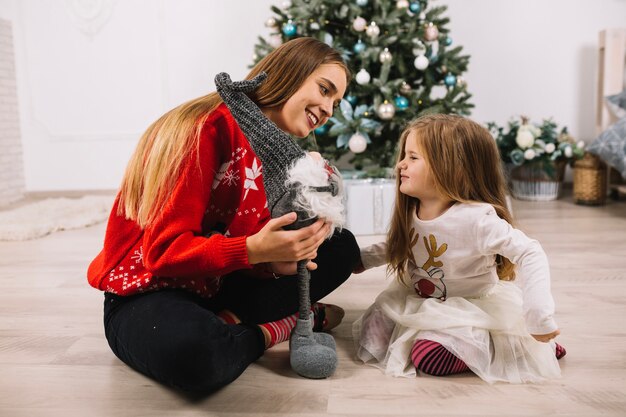 Mother and daughter celebrating christmas at home together