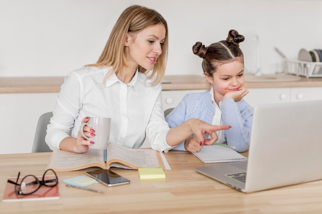 Mother and daughter doing classes together