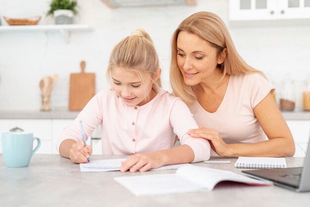 Mother and daughter doing homework together