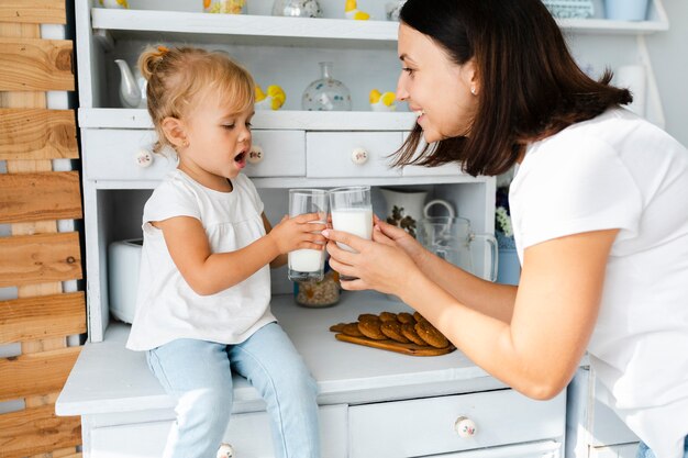Mother and daughter drinking milk