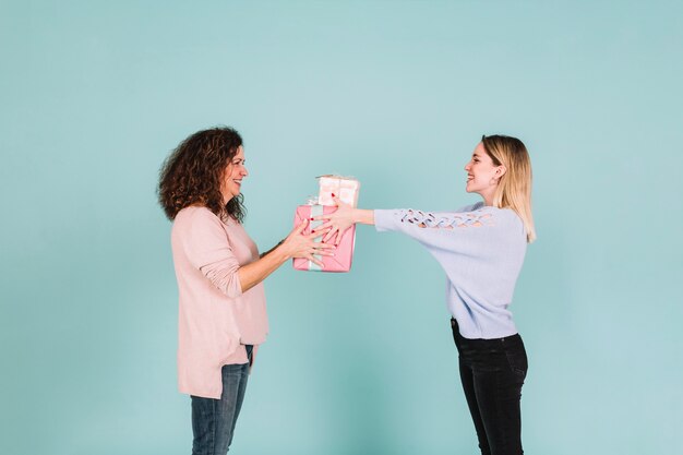 Mother and daughter exchanging presents